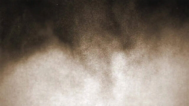 A close-up of crystalline silica dust on a black background