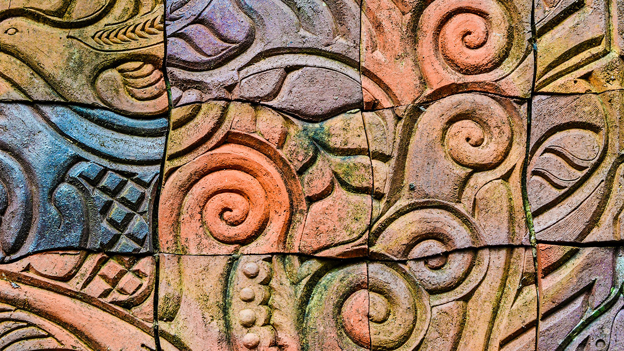 A close up photo of Maori wood carving artwork