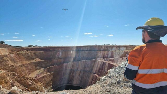 Paul Meyer flying a drone over a project site