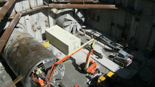 Aerial photo of a tunnel construction site showing workers and equipment