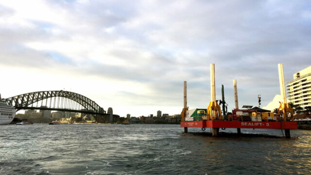 Sydney Harbour Bridge with a floating construction platform labeled "Sealift-3"